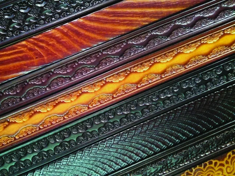 Hand-tooled leather belts by Max Whitley
