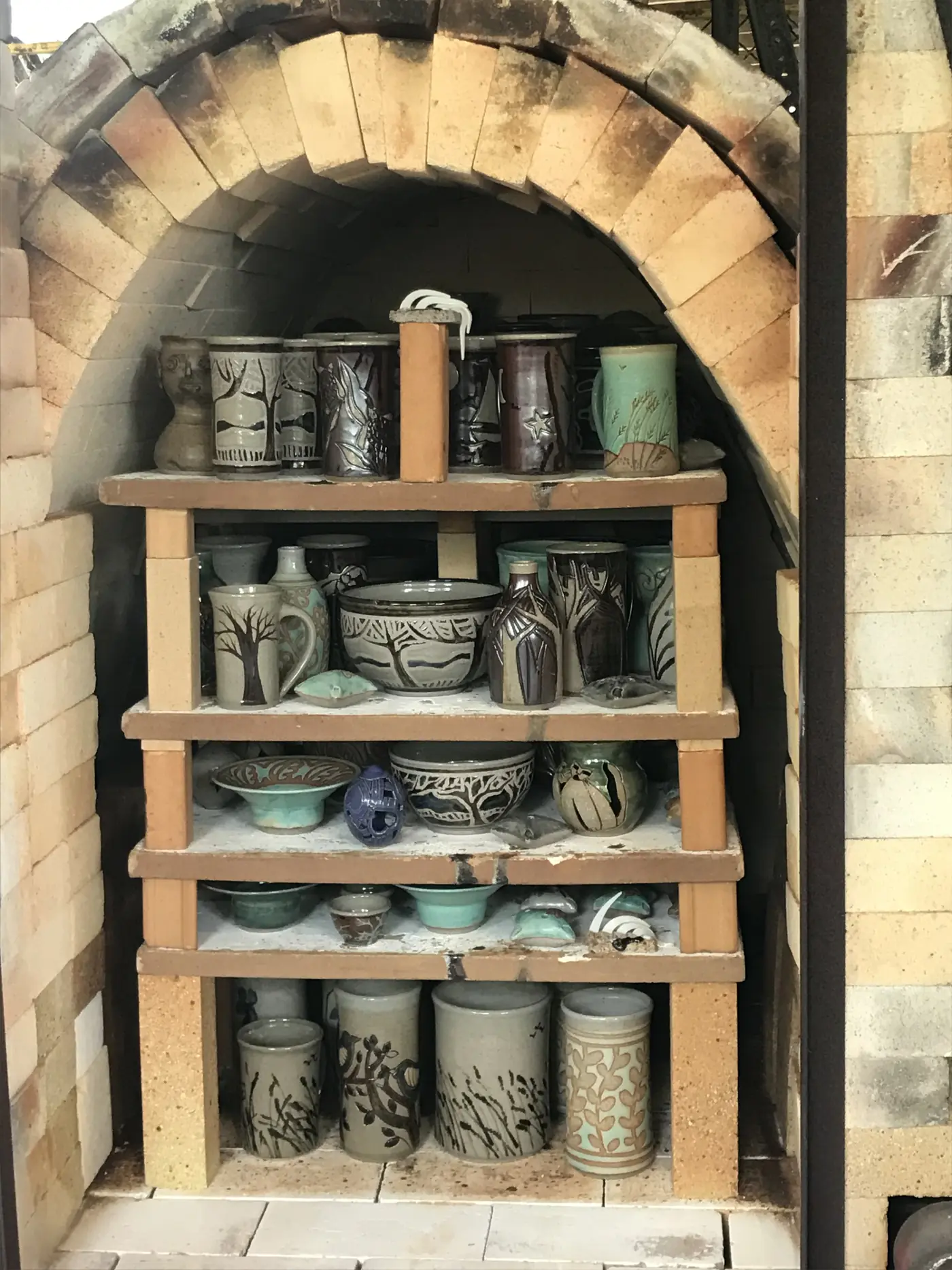 Inside the kiln: shelves of pots ready to fire